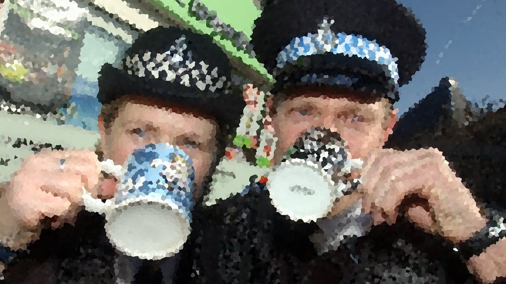 police officers drinking from police mugs